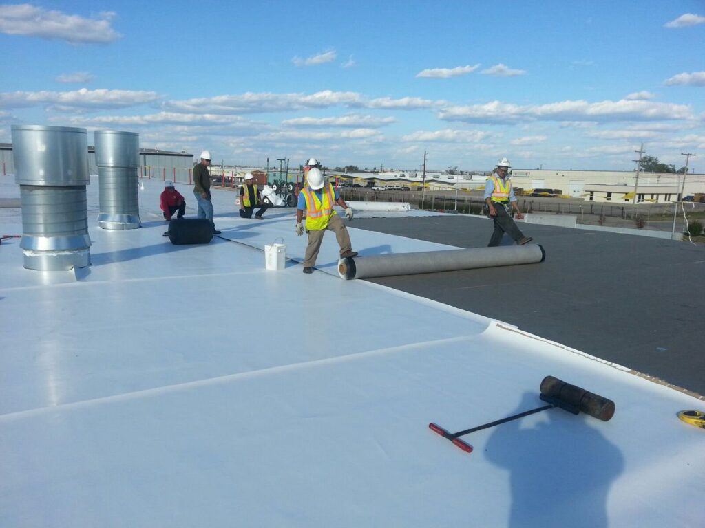 Team working on roof with TPO services in jersey city