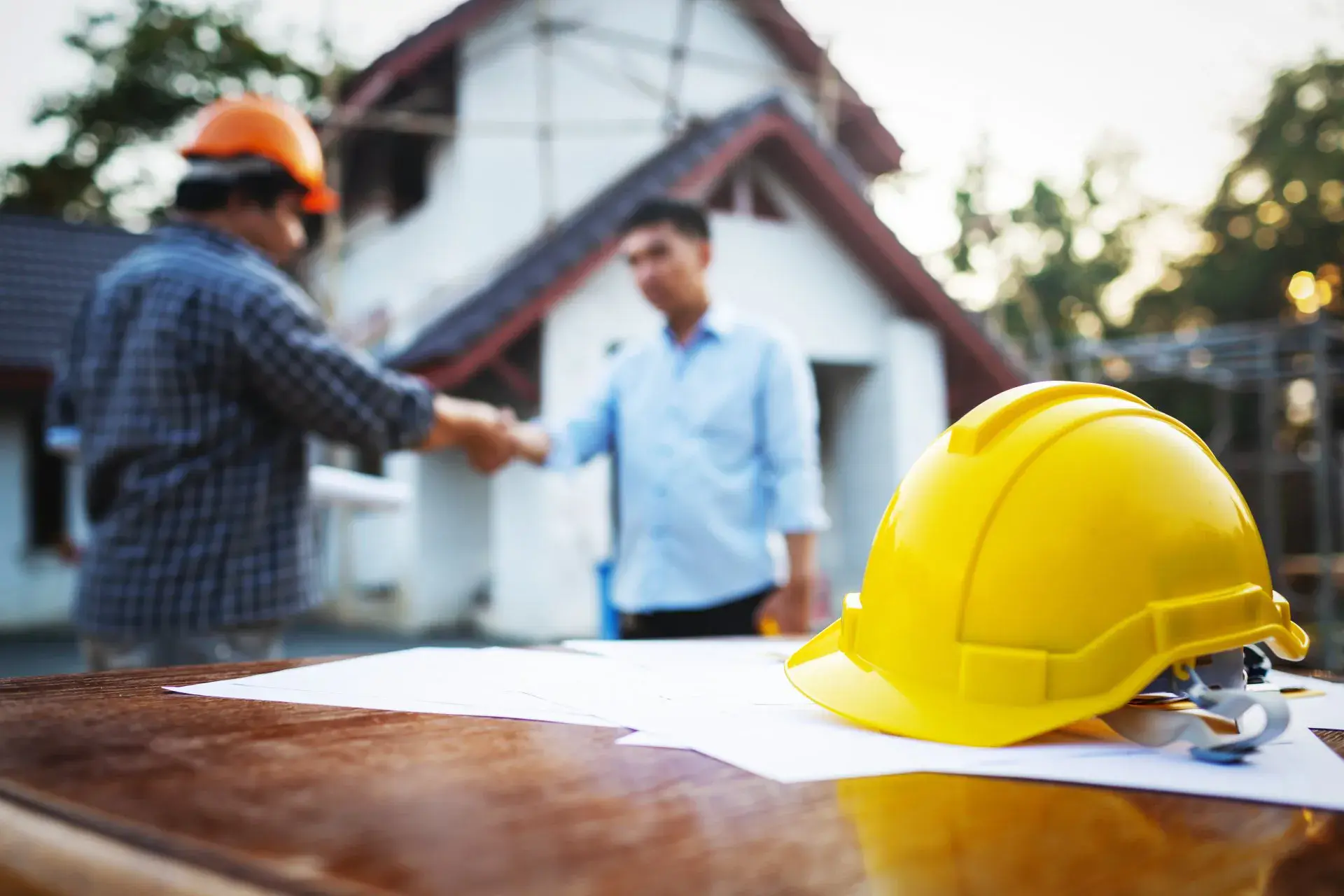 Homeowner contract sign and handshake with project manager